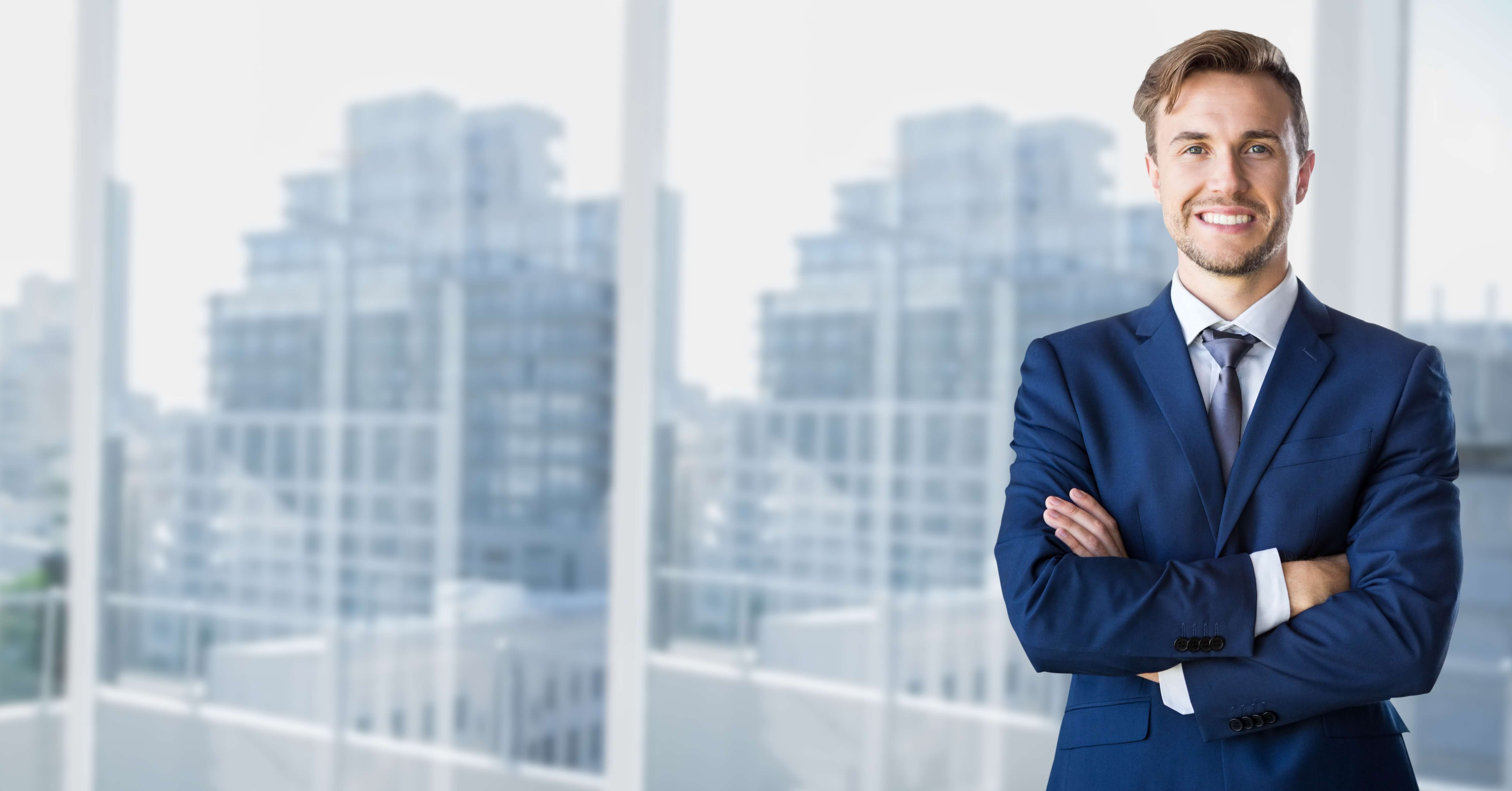 Background businessman standing with arms crossed